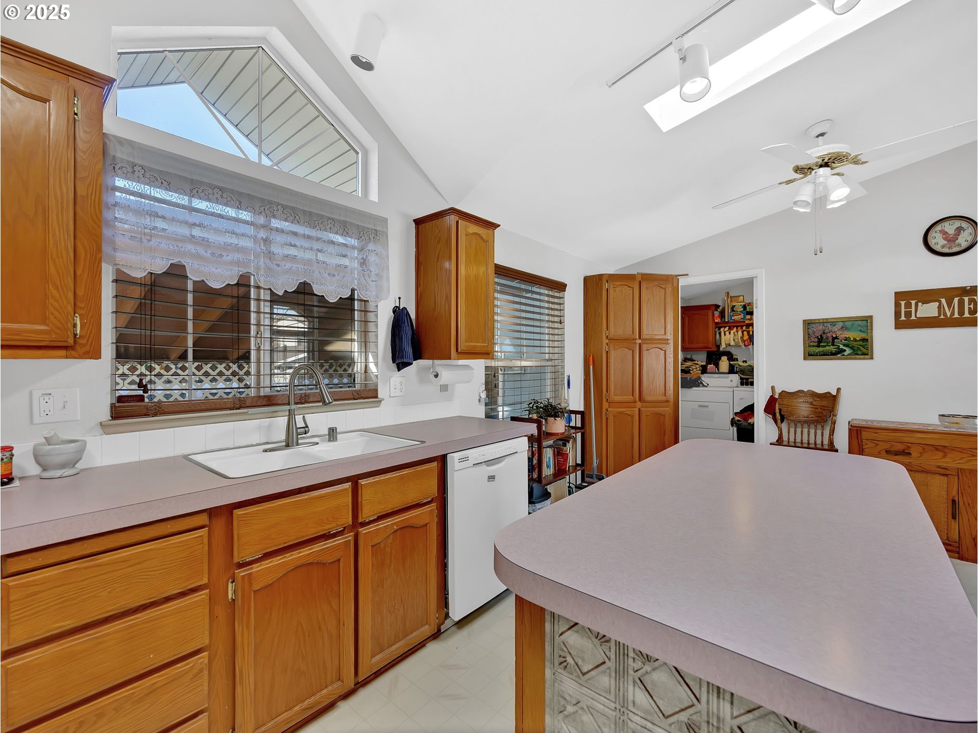 1819 Southeast Orient Drive, Unit 8 Gresham, OR 97080 - Photo 11 of 30 a very nice looking kitchen with a sink a window and chairs
