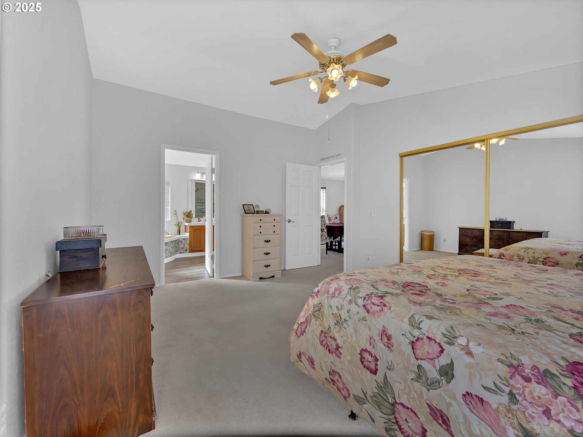 1819 Southeast Orient Drive, Unit 8 Gresham, OR 97080 - Photo 17 of 30 a bedroom with a bed and a chandelier