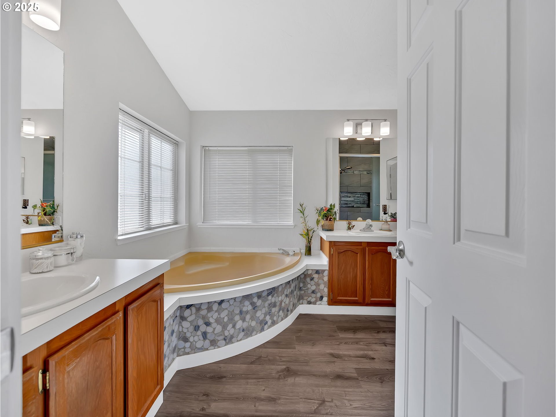 1819 Southeast Orient Drive, Unit 8 Gresham, OR 97080 - Photo 20 of 30 a bathroom with a tub sink and mirror