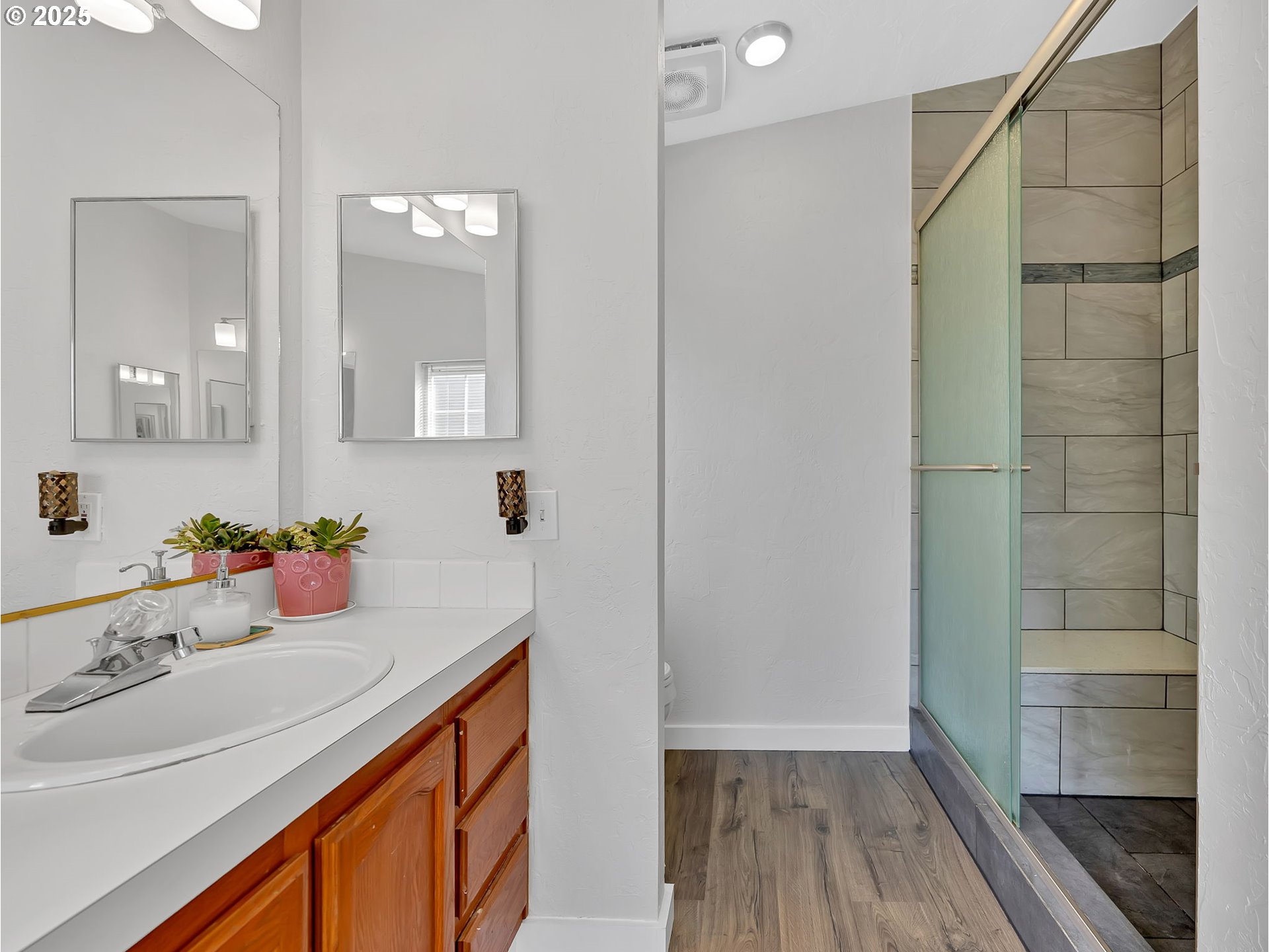 1819 Southeast Orient Drive, Unit 8 Gresham, OR 97080 - Photo 22 of 30 a bathroom with a sink and a mirror