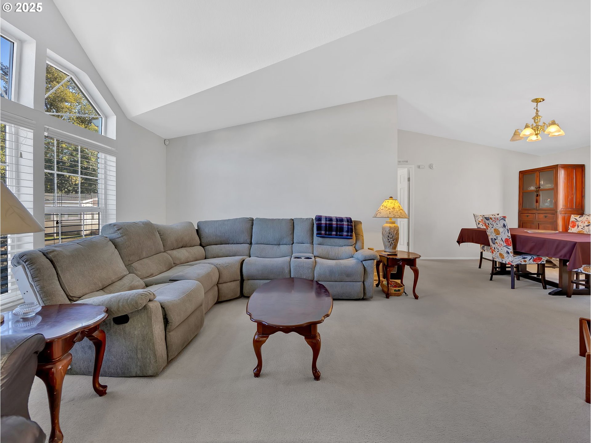 1819 Southeast Orient Drive, Unit 8 Gresham, OR 97080 - Photo 4 of 30 a living room with furniture and a potted plant on table