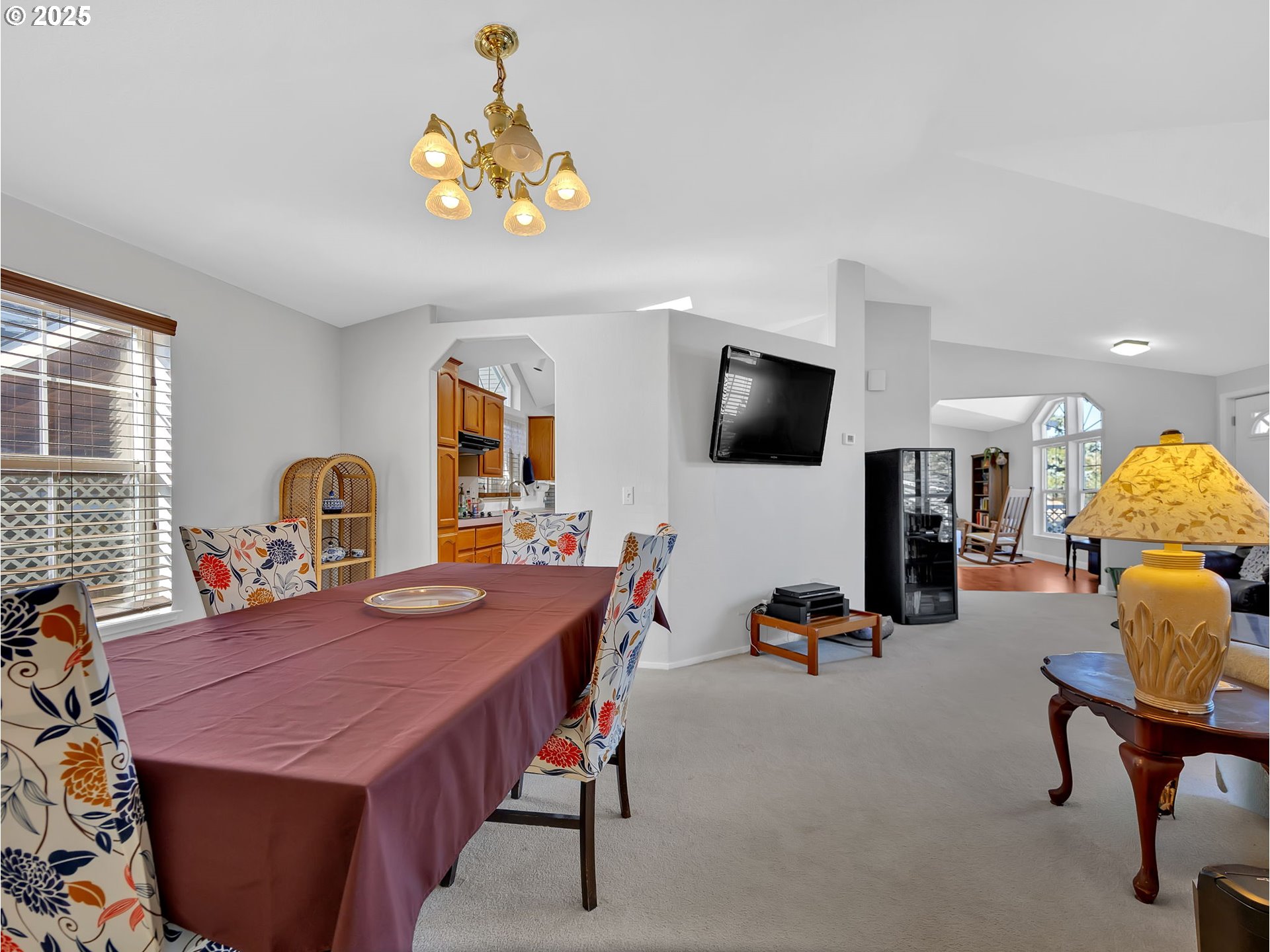 1819 Southeast Orient Drive, Unit 8 Gresham, OR 97080 - Photo 6 of 30 a view of a dining room with furniture and a flat screen tv