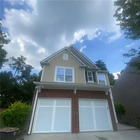 a view of house with yard