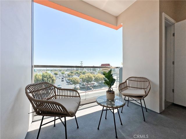 a view of a balcony with chairs