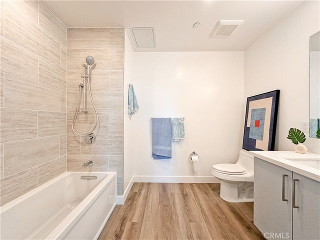 a bathroom with a toilet a sink and bathtub