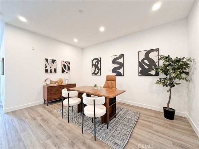 a view of a livingroom with furniture and a potted plant