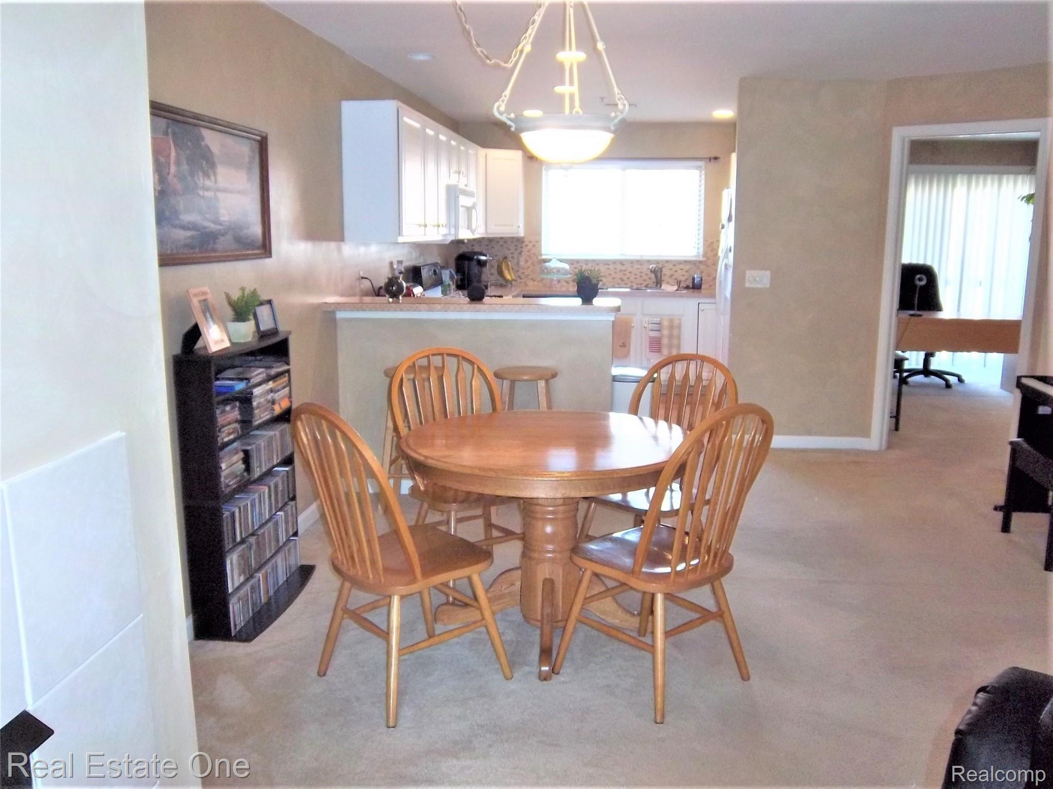 16802 Farmington Road Livonia, MI 48154 - Photo 10 of 23 DINING ROOM, KITCHEN AND DOORWAY TO FAMILY ROOM/OFFICE