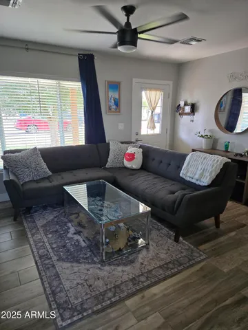 a living room with furniture and a window