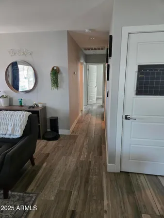 a view of a livingroom with furniture and wooden floor