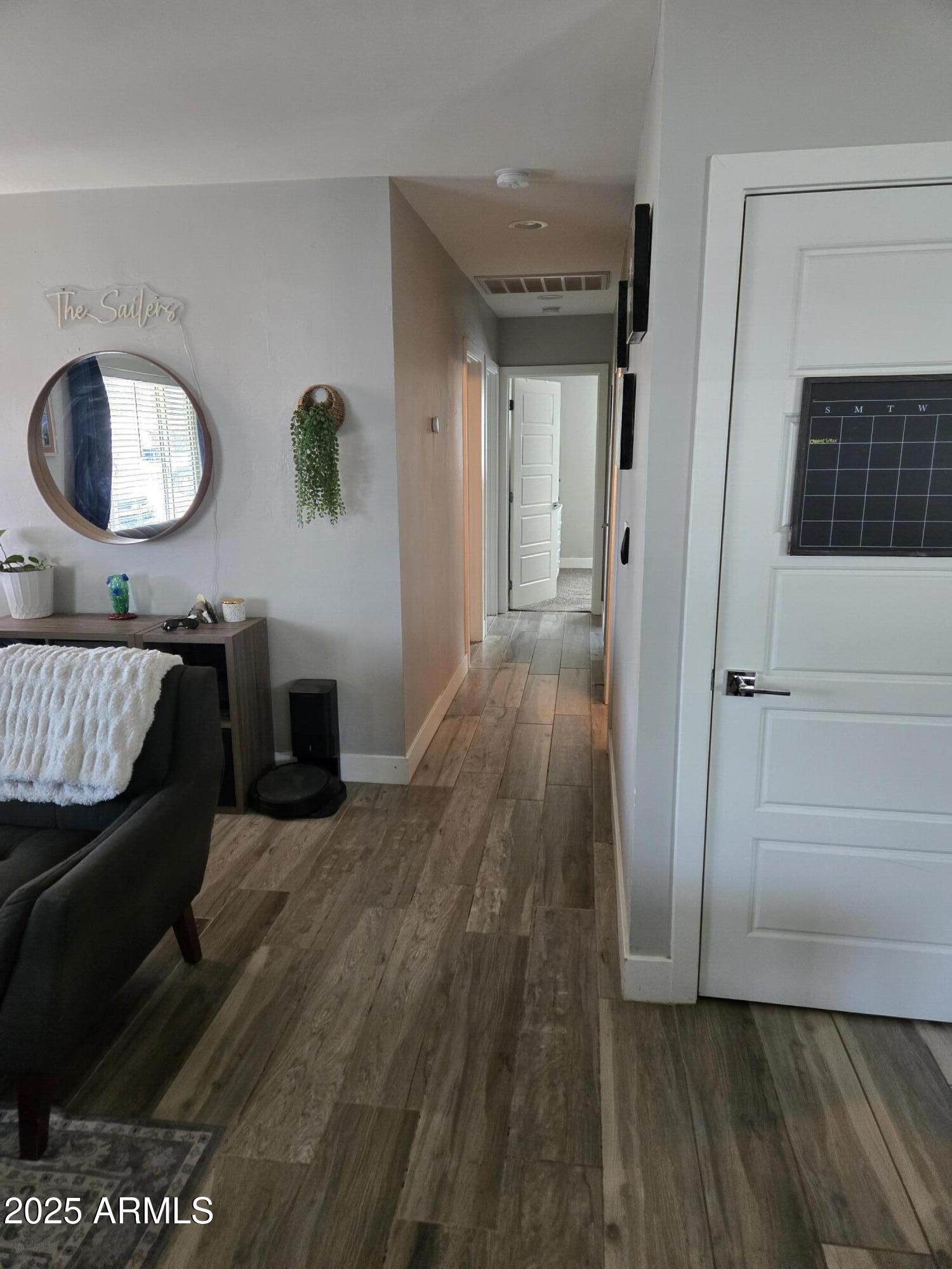 1622 East 12th Street Tempe, AZ 85281 - Photo 6 of 8 a view of a livingroom with furniture and wooden floor