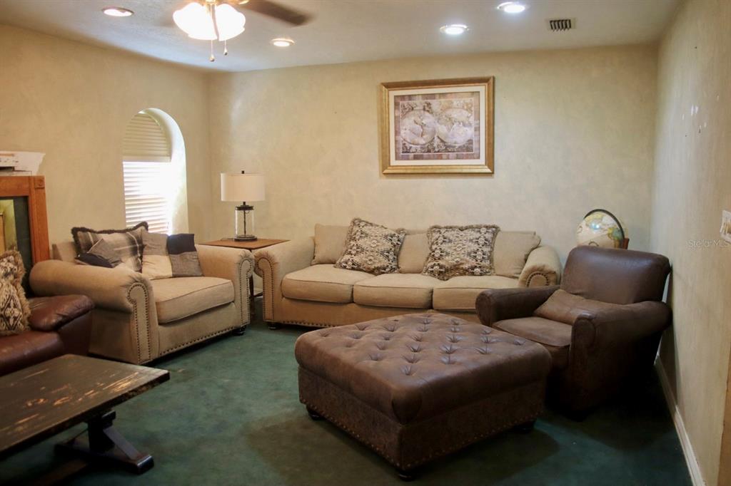 786 Southwest Bozeman Court Lake City, FL 32024 - Photo 11 of 32 a living room with furniture and a painting
