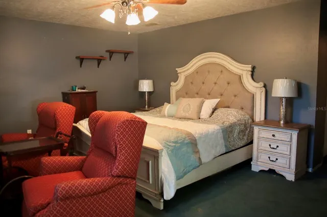 a bedroom with bed and window