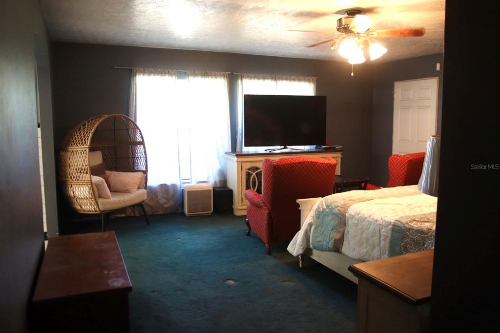 786 Southwest Bozeman Court Lake City, FL 32024 - Photo 14 of 32 a bedroom with furniture and a flat screen tv