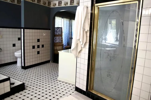 a bathroom with a glass door shower