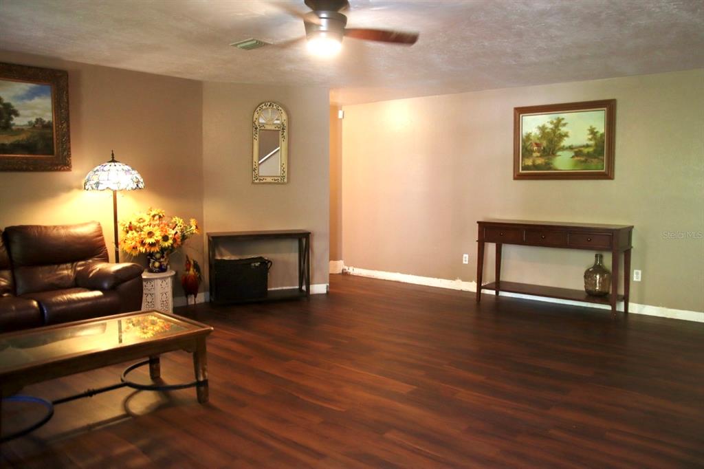 786 Southwest Bozeman Court Lake City, FL 32024 - Photo 2 of 32 a living room with furniture and a fireplace
