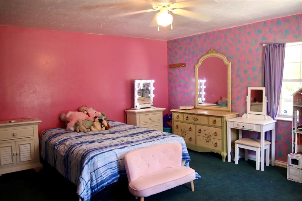 786 Southwest Bozeman Court Lake City, FL 32024 - Photo 21 of 32 a bedroom with a bed and a dresser