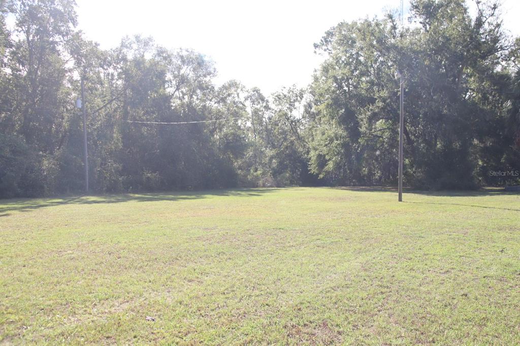 786 Southwest Bozeman Court Lake City, FL 32024 - Photo 30 of 32 a view of a swimming pool and an outdoor space