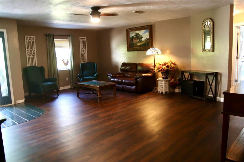 786 Southwest Bozeman Court Lake City, FL 32024 - Photo 4 of 32 a living room with furniture and wooden floor