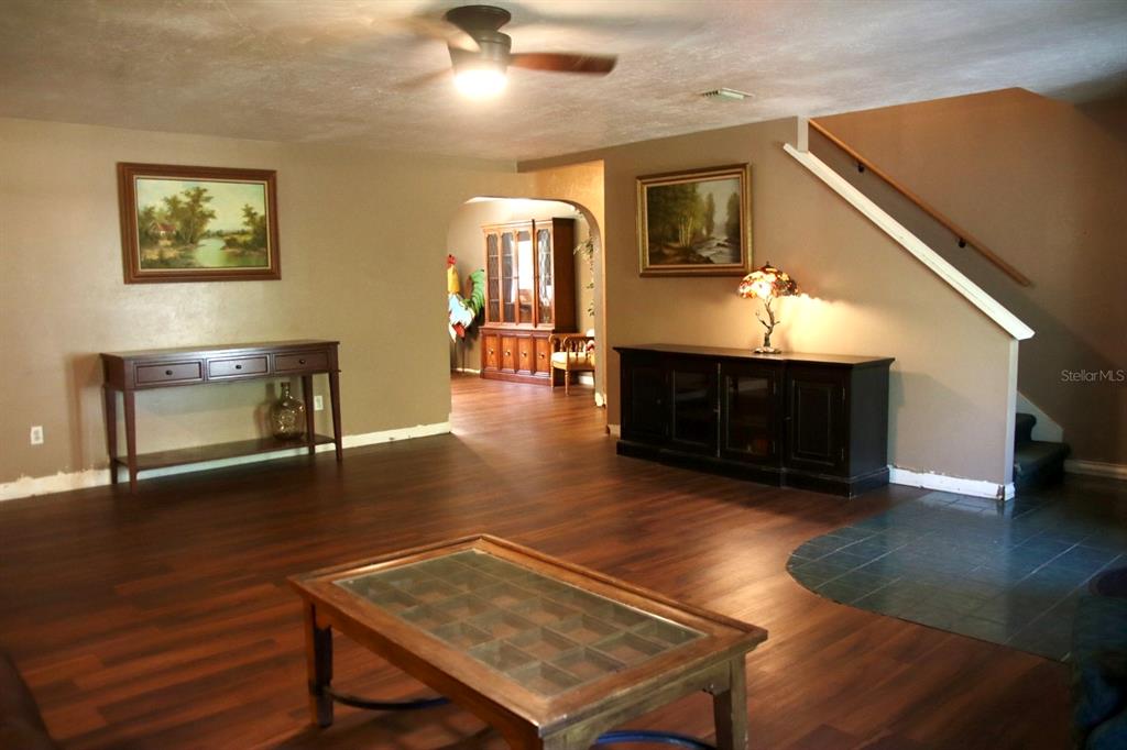 786 Southwest Bozeman Court Lake City, FL 32024 - Photo 5 of 32 a living room with furniture a fireplace and a flat screen tv
