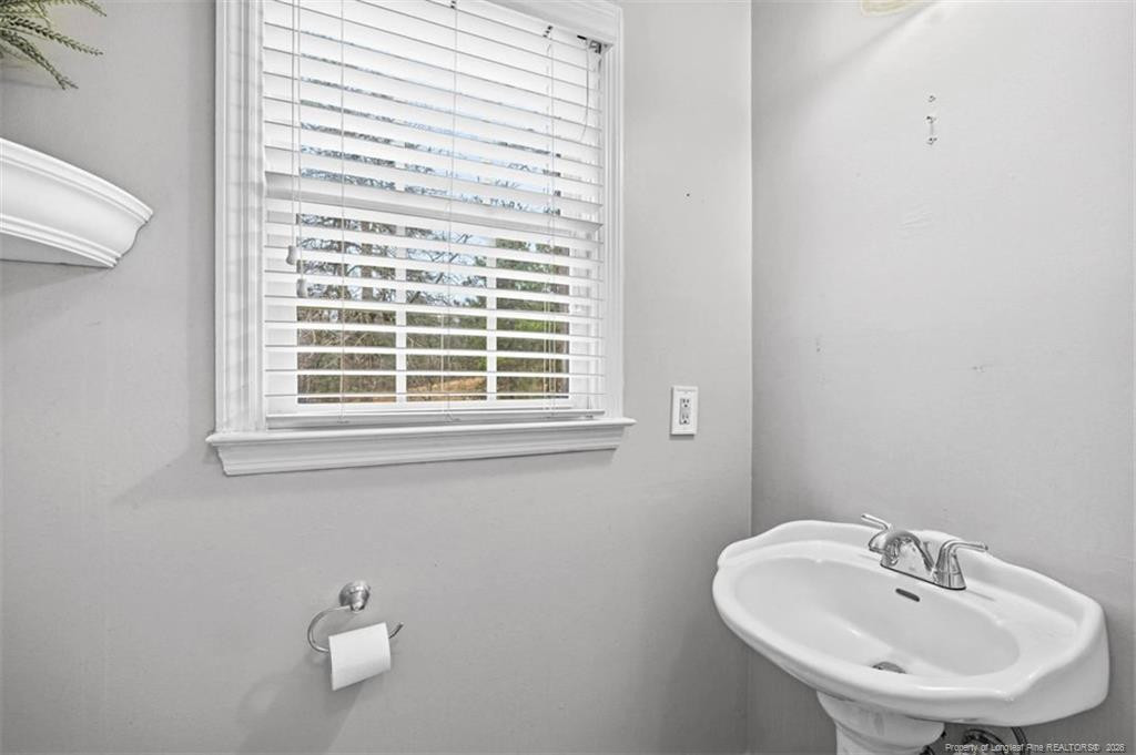 403 Lionshead Road Fayetteville, NC 28311 - Photo 12 of 49 a bathroom with a sink and a window
