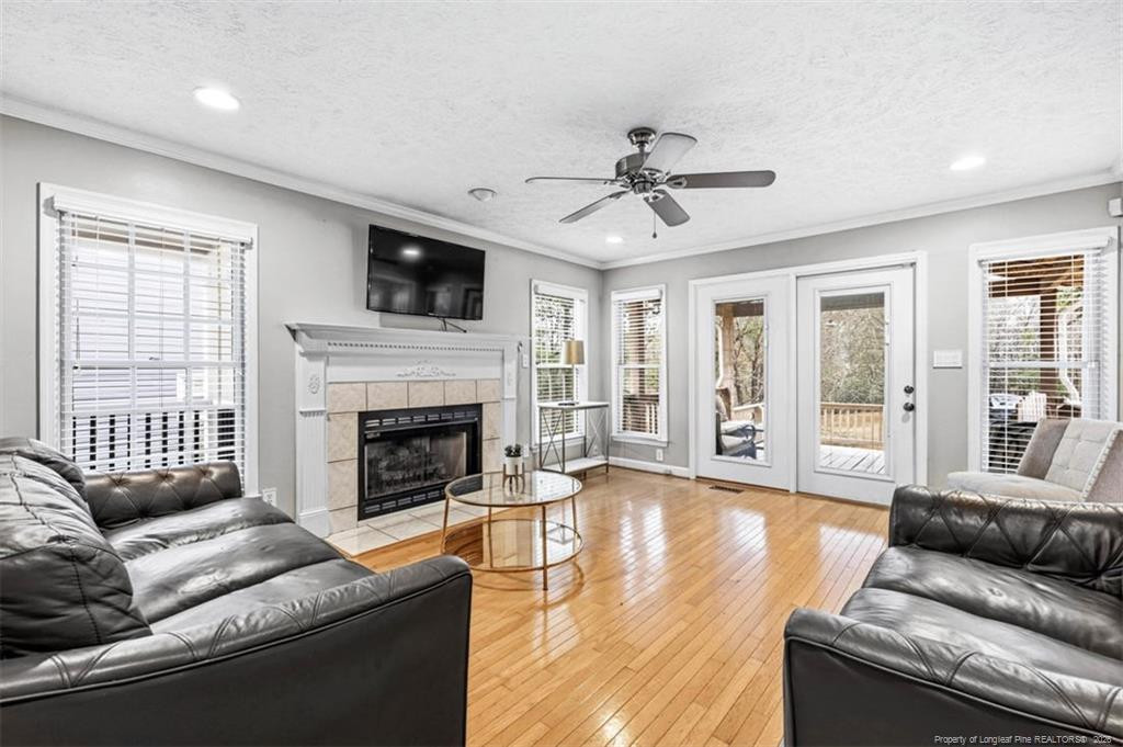 403 Lionshead Road Fayetteville, NC 28311 - Photo 14 of 49 a living room with furniture and a fireplace