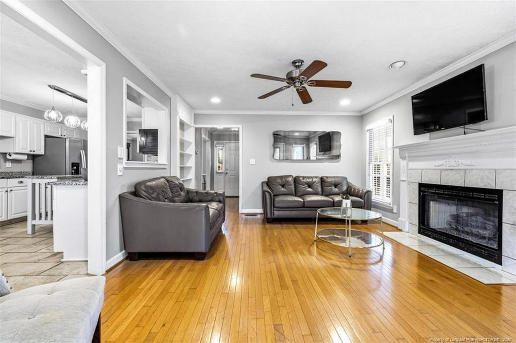 403 Lionshead Road Fayetteville, NC 28311 - Photo 17 of 49 a living room with furniture fireplace and flat screen tv
