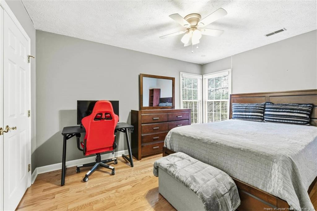 403 Lionshead Road Fayetteville, NC 28311 - Photo 32 of 49 a bedroom with a bed dresser and a window