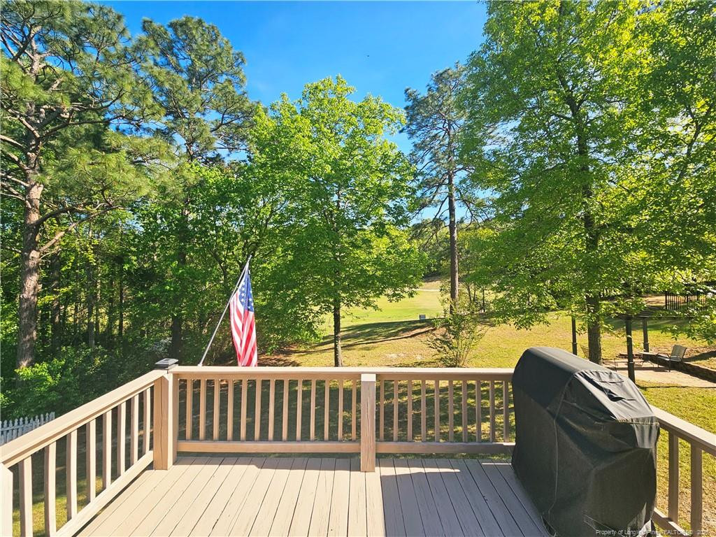 403 Lionshead Road Fayetteville, NC 28311 - Photo 35 of 49 a view of balcony with wooden floor and outdoor seating