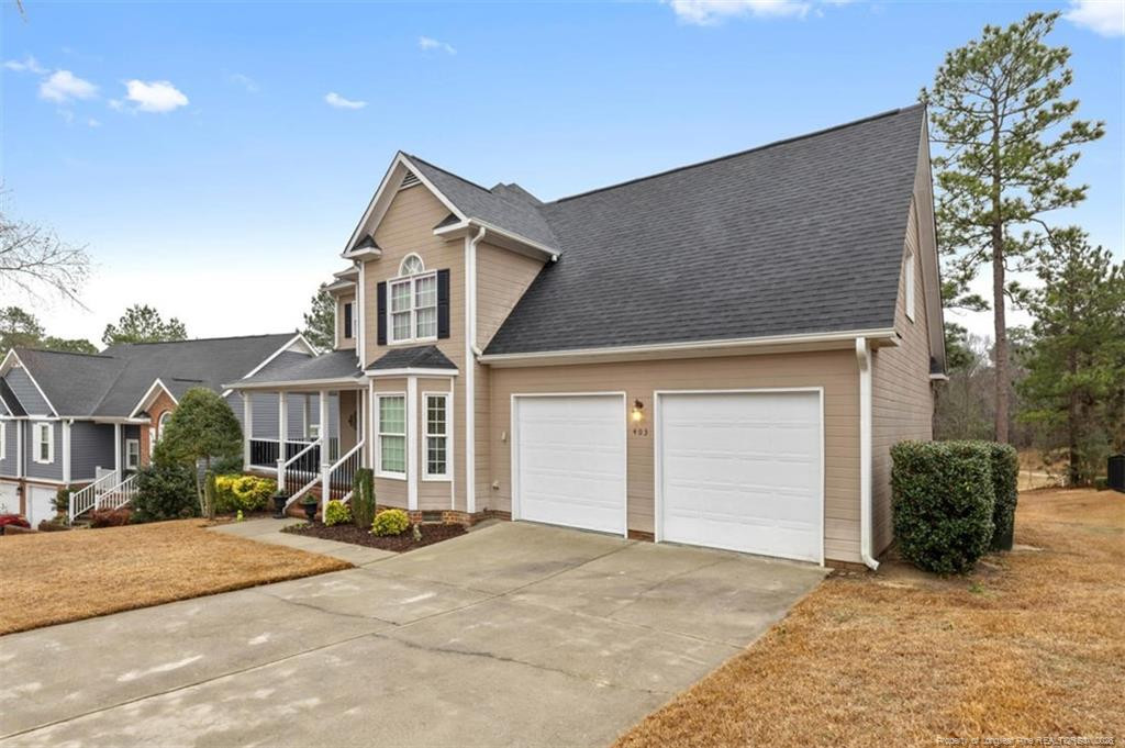 403 Lionshead Road Fayetteville, NC 28311 - Photo 40 of 49 a front view of a house with a yard and garage