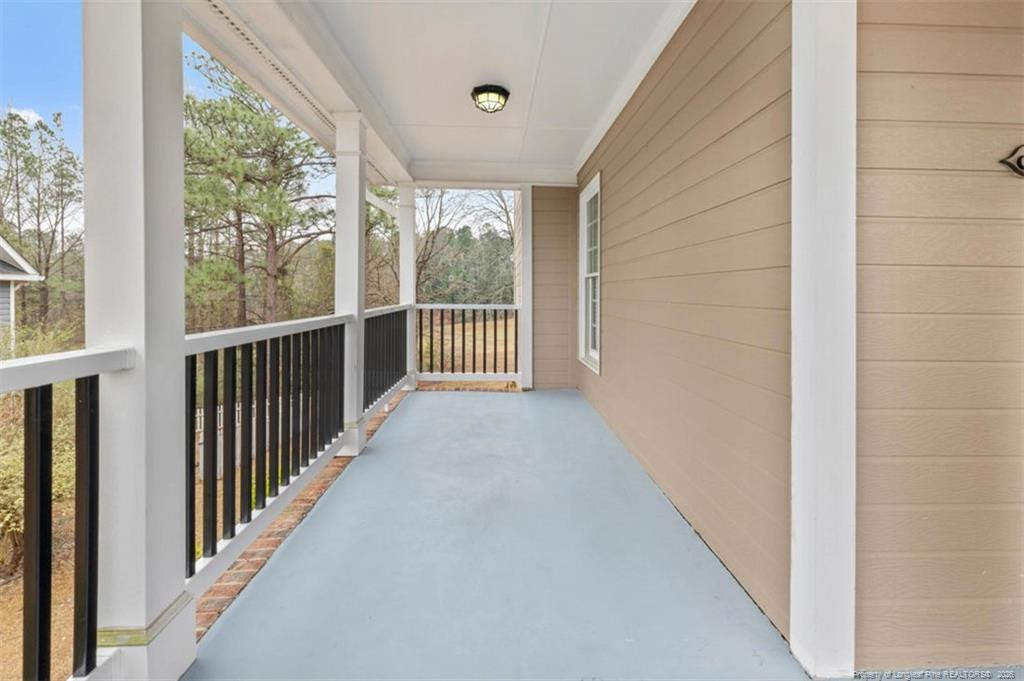 403 Lionshead Road Fayetteville, NC 28311 - Photo 41 of 49 a view of a balcony with wooden floor