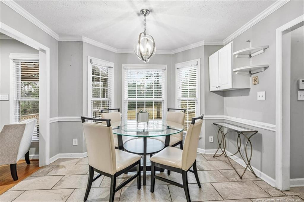 403 Lionshead Road Fayetteville, NC 28311 - Photo 10 of 49 a dining room with furniture and windows