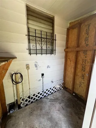 a view of a kitchen from the hallway