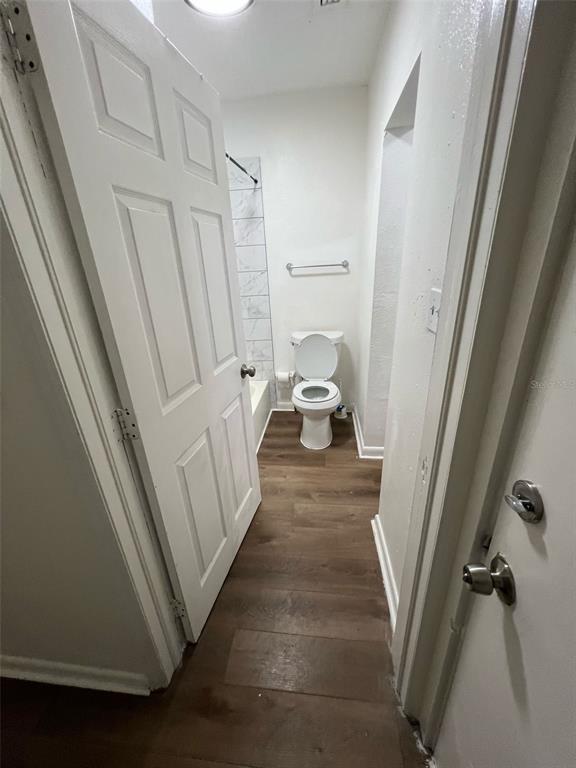 1936 West Cherry Street Tampa, FL 33607 - Photo 14 of 21 a view of a hallway with wooden floor and staircase