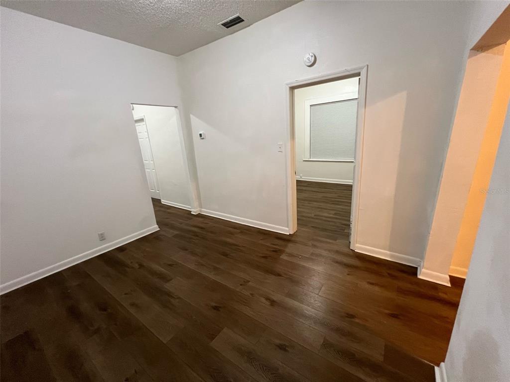 1936 West Cherry Street Tampa, FL 33607 - Photo 15 of 21 an empty room with wooden floor and closet