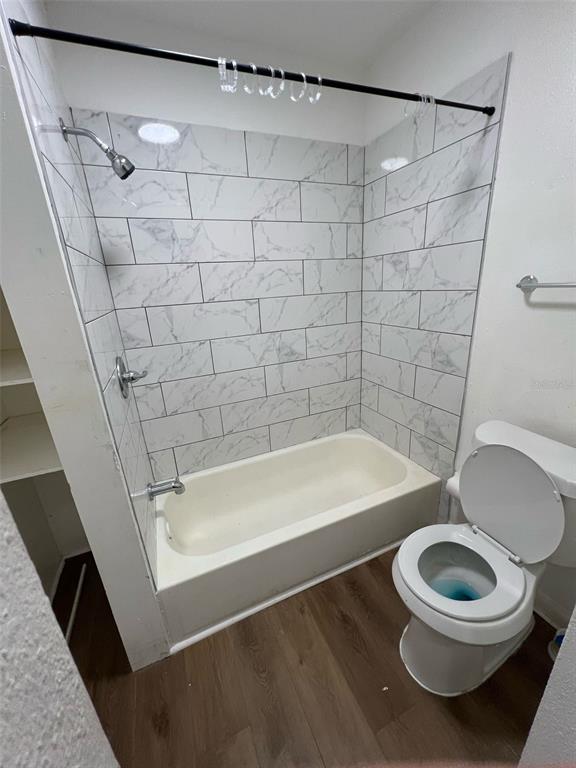 1936 West Cherry Street Tampa, FL 33607 - Photo 6 of 21 a bathroom with a toilet and a bathtub