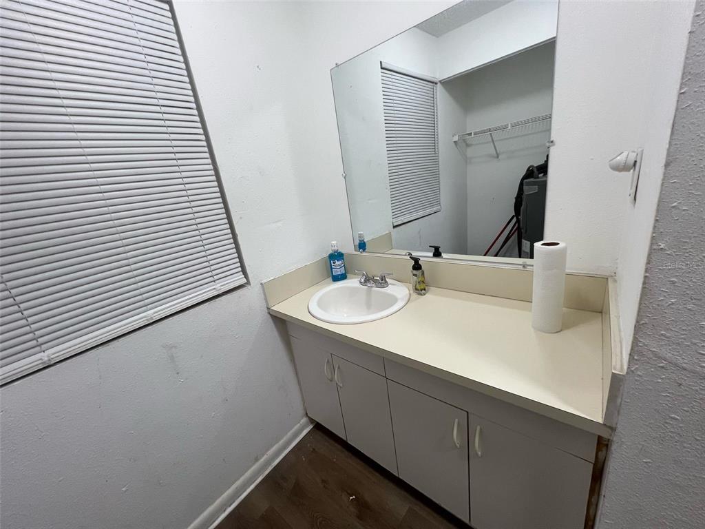 1936 West Cherry Street Tampa, FL 33607 - Photo 7 of 21 a bathroom with a sink and a mirror