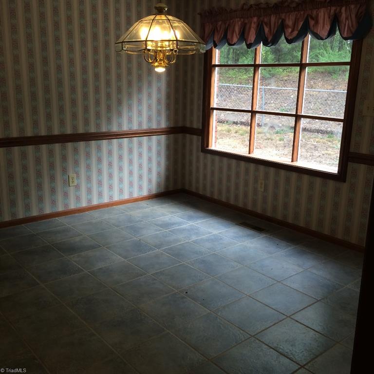 94 Burrage Road Northeast Concord, NC 28025 - Photo 4 of 15 Breakfast area w/tile floors