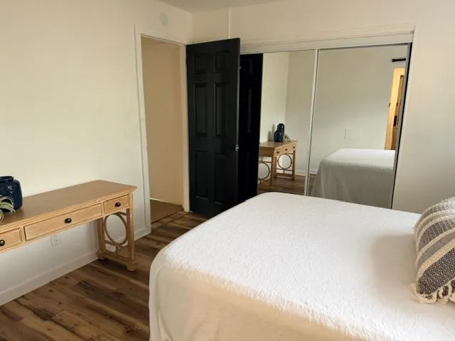 a bedroom with a bed and a table