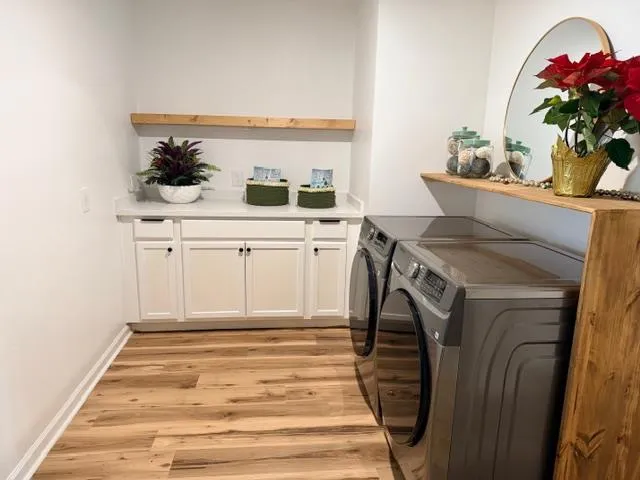 a spacious bathroom with a sink and a mirror