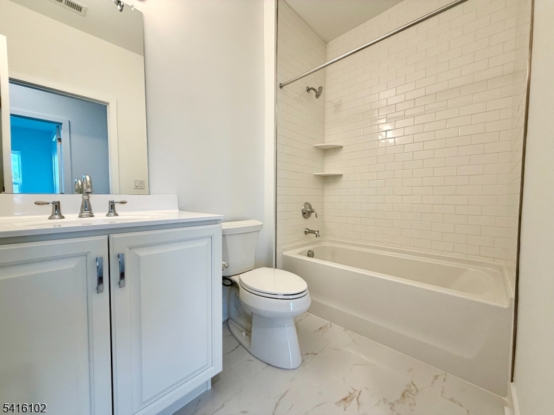 26 Arowana Road Randolph, NJ 07869 - Photo 17 of 26 a bathroom with a sink toilet and shower