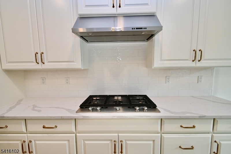 26 Arowana Road Randolph, NJ 07869 - Photo 9 of 26 a stove top oven sitting inside of a kitchen
