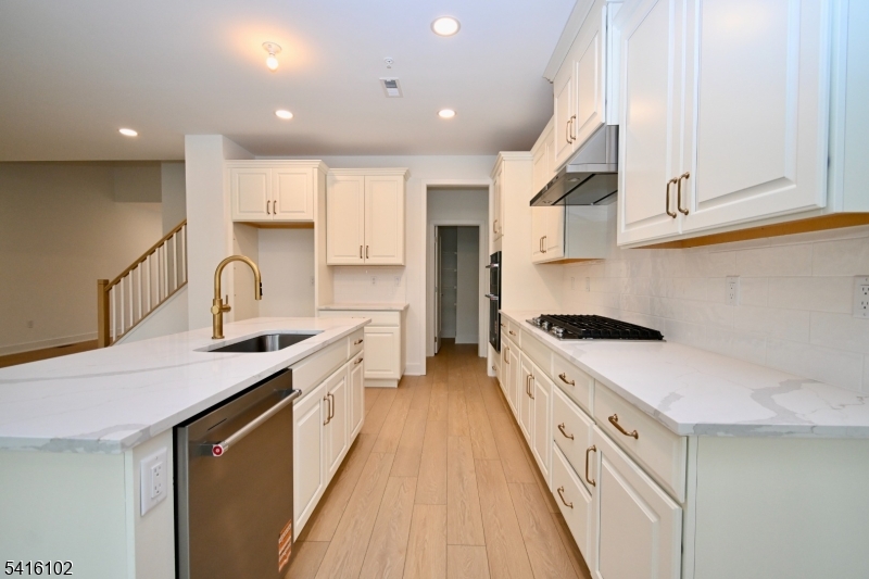 26 Arowana Road Randolph, NJ 07869 - Photo 10 of 26 a large kitchen with stainless steel appliances granite countertop a lot of counter space and a sink