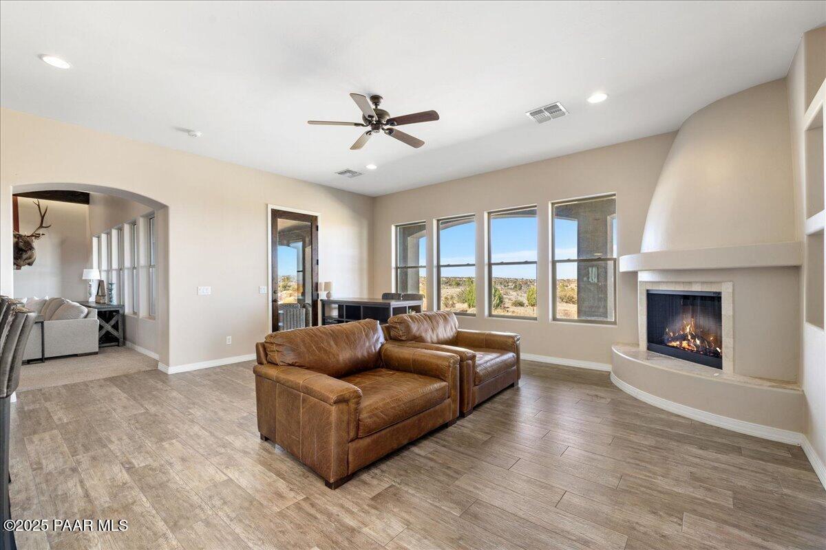 12300 West Slate Road Prescott, AZ 86305 - Photo 16 of 59 a living room with furniture and a fireplace