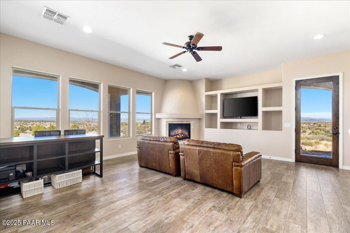 12300 West Slate Road Prescott, AZ 86305 - Photo 17 of 59 a living room with furniture and a flat screen tv