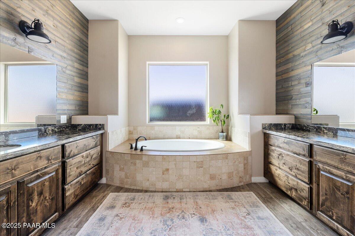 12300 West Slate Road Prescott, AZ 86305 - Photo 20 of 59 a spacious bathroom with a tub double sink and mirror