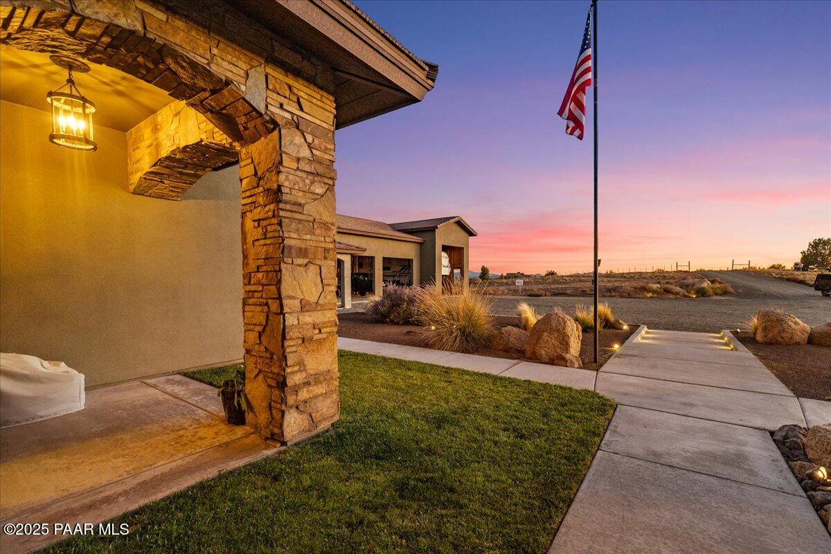 12300 West Slate Road Prescott, AZ 86305 - Photo 2 of 59 a view of a patio with a table and chairs