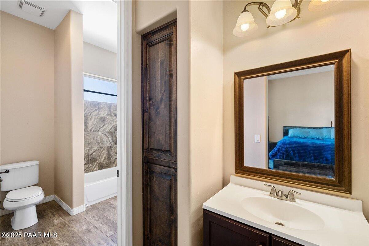 12300 West Slate Road Prescott, AZ 86305 - Photo 25 of 59 a bathroom with a sink and a mirror