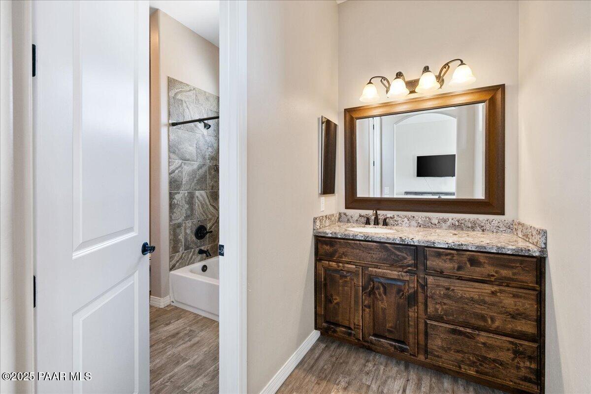 12300 West Slate Road Prescott, AZ 86305 - Photo 27 of 59 a bathroom with a sink and mirror with toilet