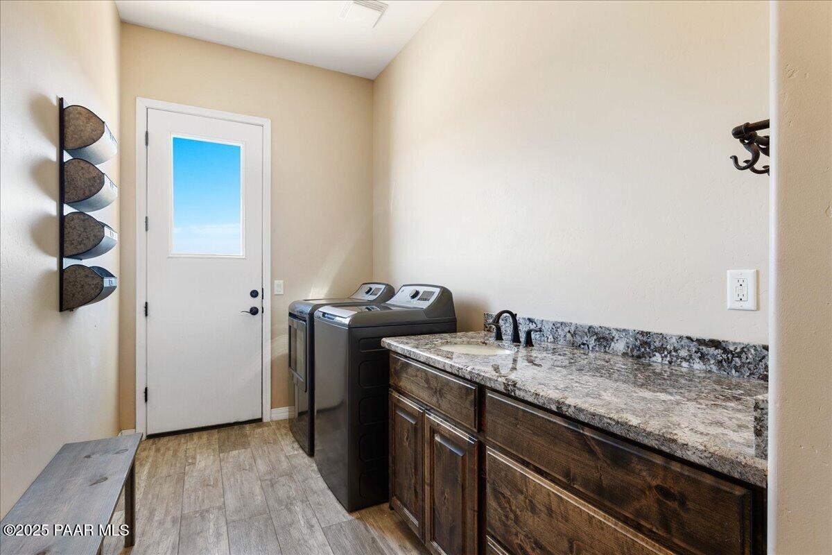 12300 West Slate Road Prescott, AZ 86305 - Photo 29 of 59 a bathroom with a granite countertop sink and a mirror