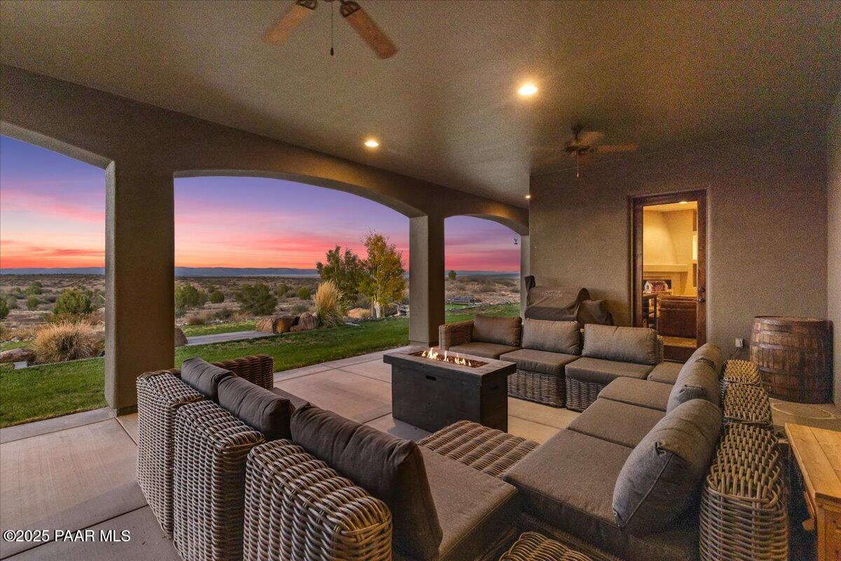 12300 West Slate Road Prescott, AZ 86305 - Photo 30 of 59 a living room with furniture and a floor to ceiling window